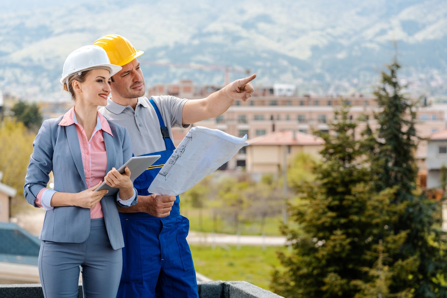 Property Developer and Construction Worker Creating Project Together